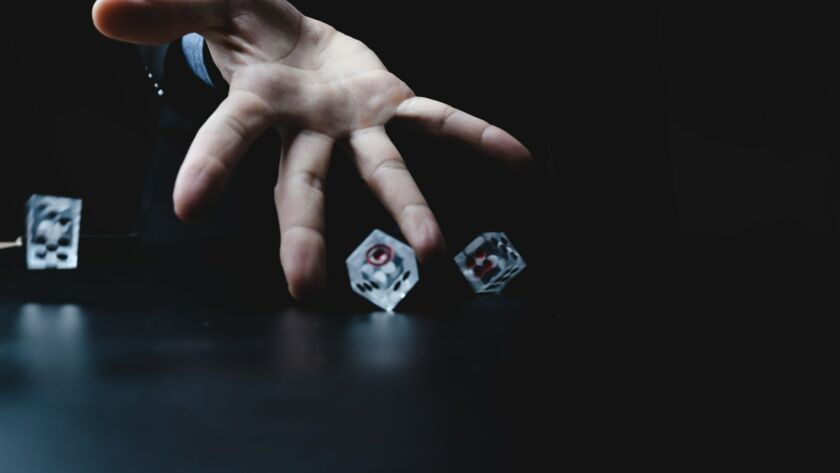Closeup of hands of a young male entrepreneur and businessman in formal suit clothing