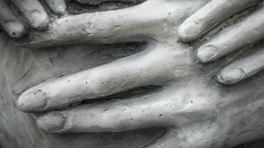 Hands in darkness