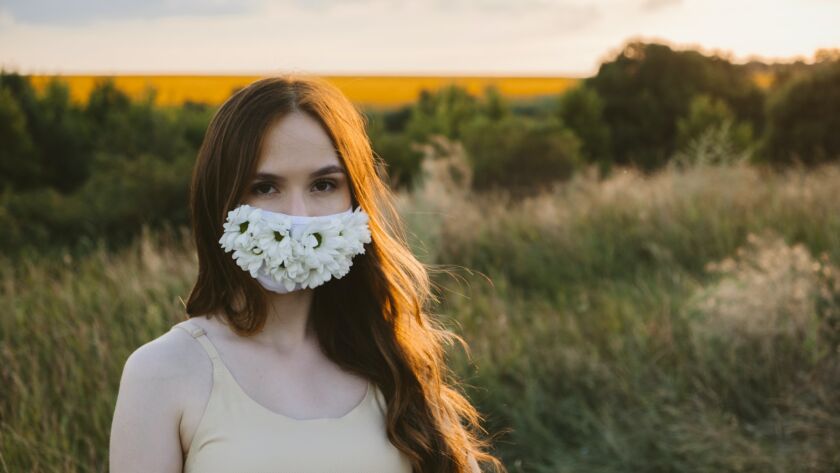 New normal, lockdown, face mask. Outdoor portrait of woman in protective face Statement Masks with